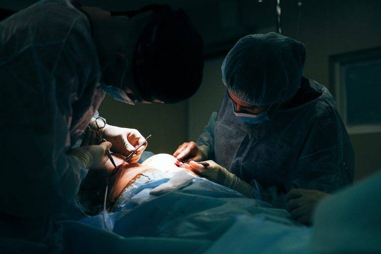 Doctors in the operating room of a plastic surgery clinic
