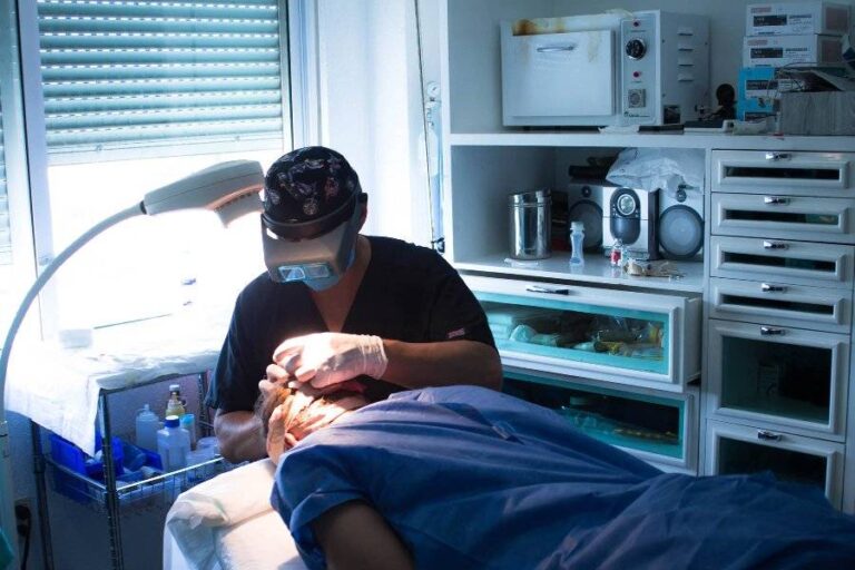 Doctor placing hair implants in patient