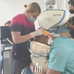 Surgeon working with an ARTAS hair transplant robotic arm