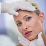 Plastic surgery; woman preparing for a facial plastic surgery