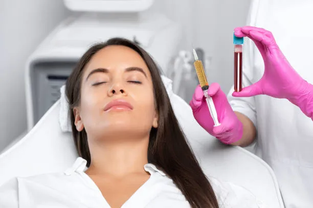 Female doctor injecting PRP treatment into a woman’s scalp, stimulating hair follicles and promoting new growth for hair restoration therapy.